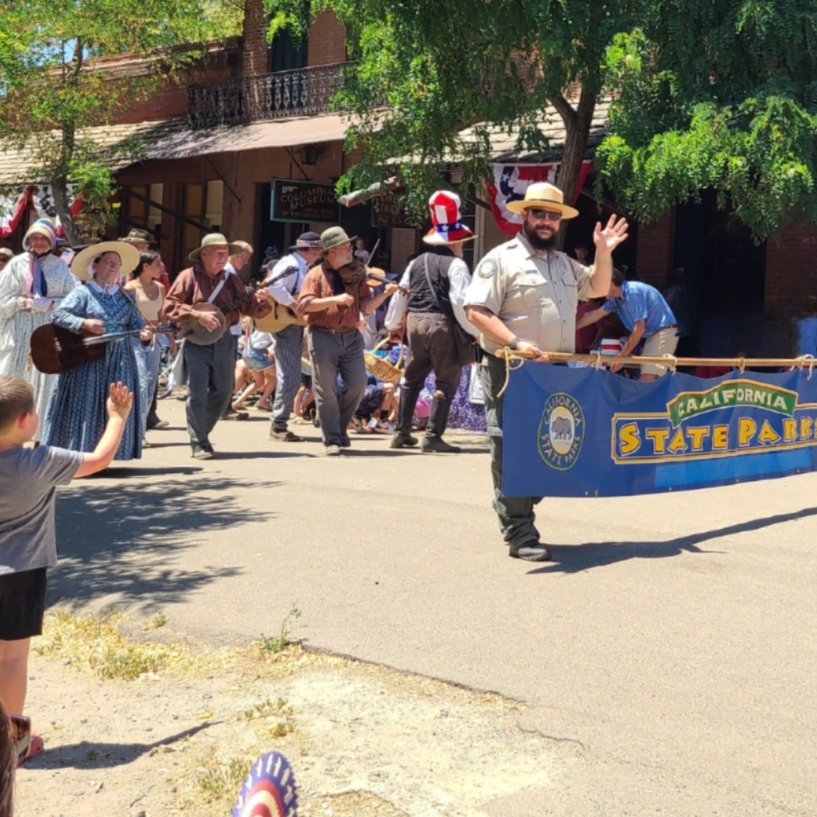 Staff carrying banner in parade 
